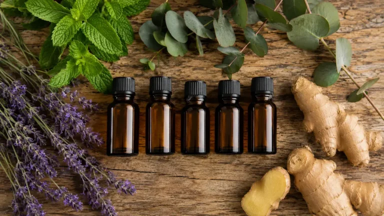 aceites esenciales dōTERRA para el dolor de espalda — lavanda menta eucalipto sobre mesa de madera